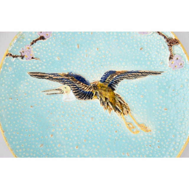 A rare antique turquoise majolica flying crane plate by Joseph Holdcroft, Longton, England, circa 1870. Maker's mark on...