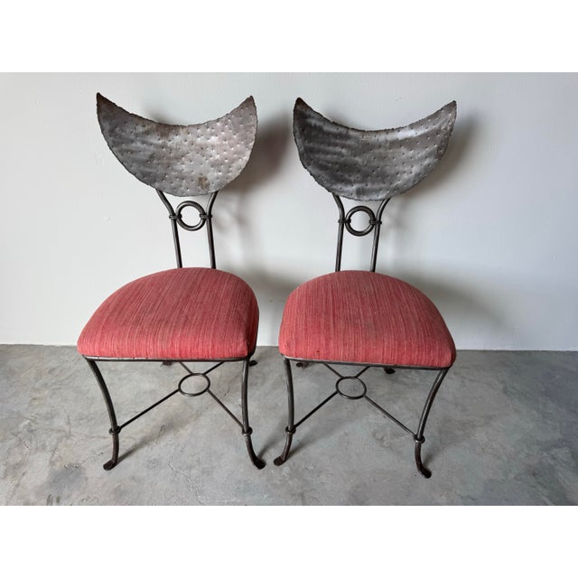 Distinctive and artful, this pair of 1980’s handmade Brutalist dining chairs features bold sculptural forms and a striking...