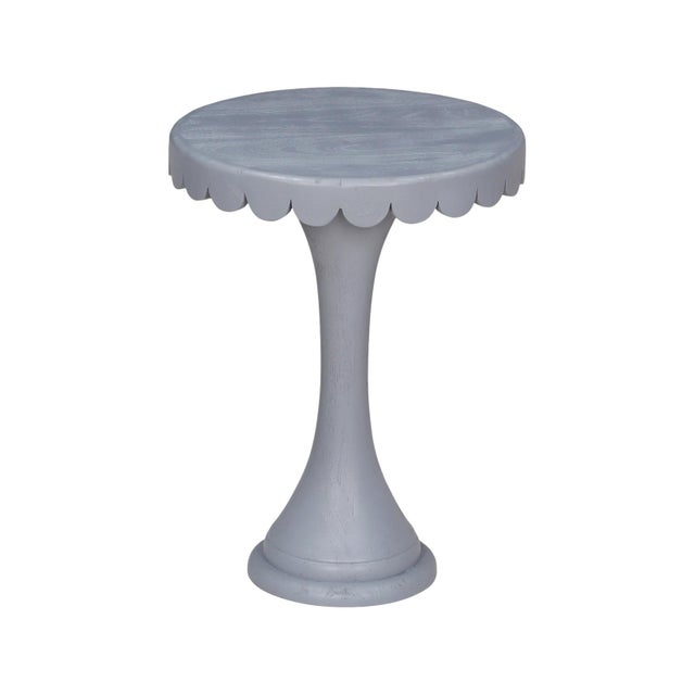 Crafted from natural wood, this scalloped accent tables add a joyful pop of color and character to any space. The softly...