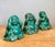 This charming set of three vintage ceramic Buddha figurines offers a playful yet serene interpretation of the classic "see...
