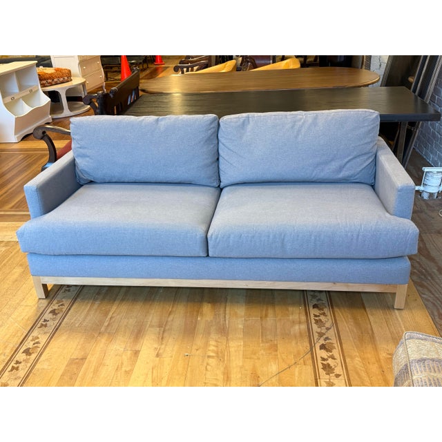 Design Plus Gallery presents the Devon Sofa from Clad Home. Upholstered in a light gray with heathering textile, this sofa...
