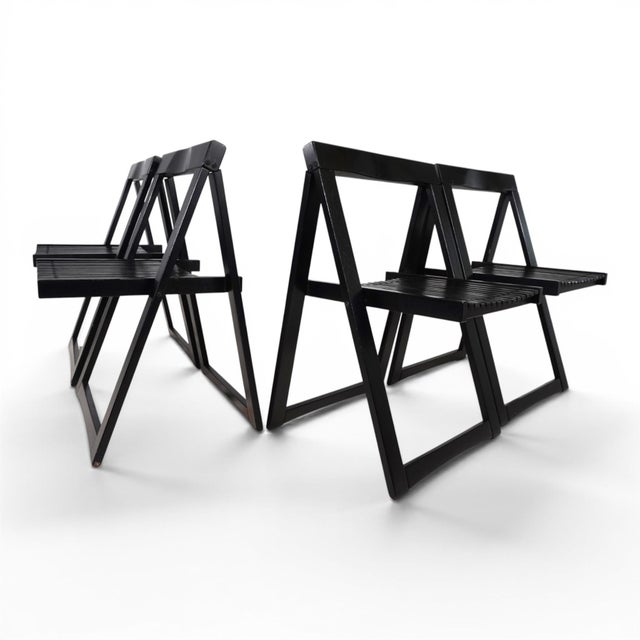 This iconic set of four "Trieste" folding chairs by Aldo Jacober for Bazzani combines the characteristic clarity of...