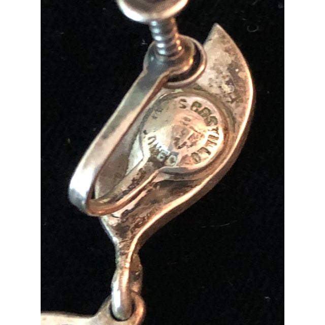 This is part of Chairish’s Costume Jewelry assortment. This vintage pair of Los Castillo Turquoise Sterling Dangle...