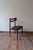 A set of five Danish dining chairs from the 1960s in solid teak, recognisable by their open, cut-out backrests and their...