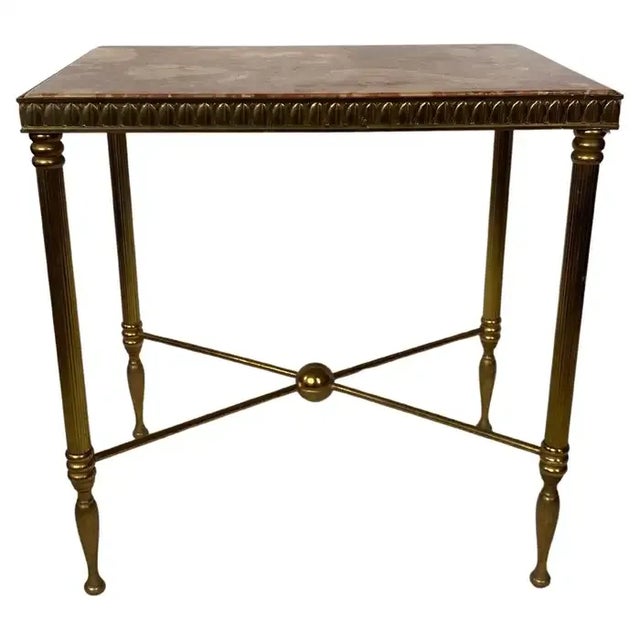 Neoclassical style rectangular side or end table in the manner of Maison Bagues. The beautifully patinated brass base...