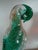 Vintage blown glass parrot with controlled bubbles throughout sculpture.. The bright green color is unusual. The bird sits...