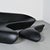 The sculptural "Moon System" sofa, designed by Zaha Hadid in 2007 for B&B Italia. Its silhouette evokes a monolithic...