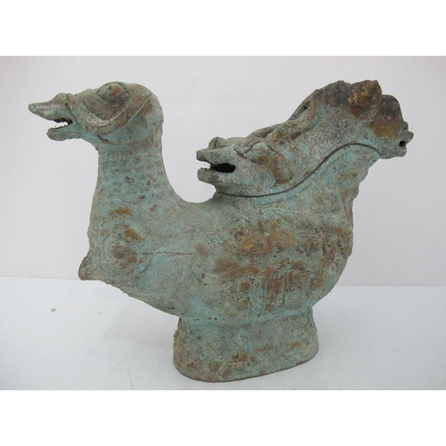 Chinese ritual bronze Guang wine vessel, a type of ewer primarily used during the Shang and Western Zhou dynasties. This...