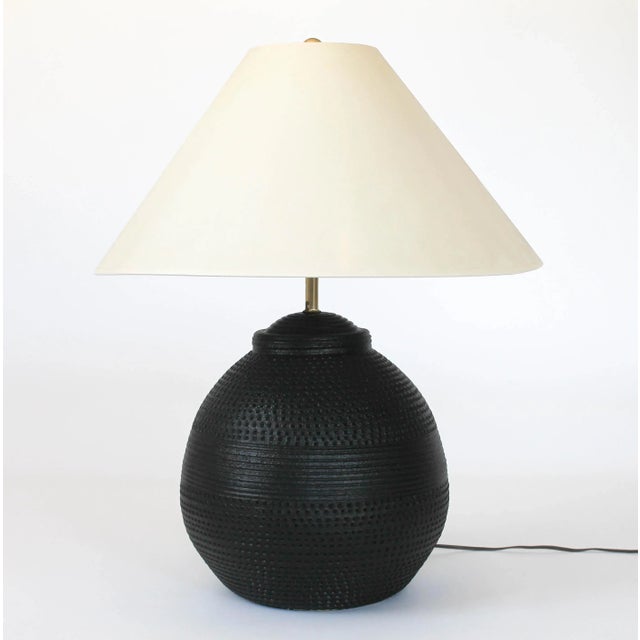 Vintage S+M Industries clay chalkware ginger jar lamp. The surface has been painted with flat black paint, giving it a...
