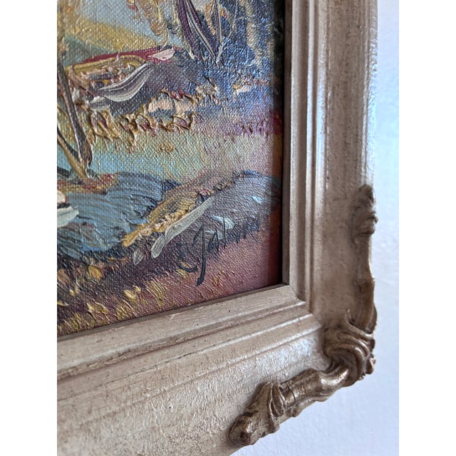 This vintage original oil painting from around the 1960s shows a peaceful lake with trees, hills, and mountains in the...