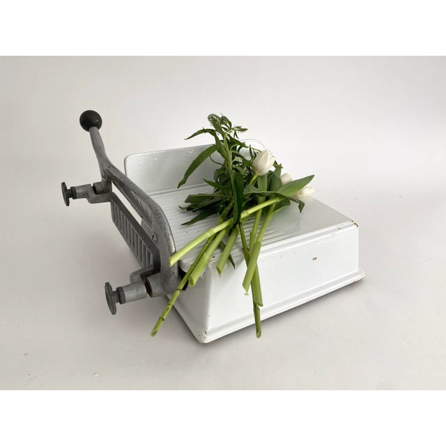 A fabulous addition for your kitchen. This mid-century enamel cheese or meat slicer comes from a neighborhood la...
