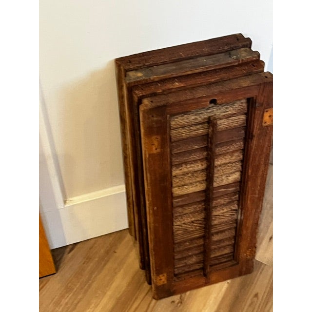 Vintage louvered wooden shutters for decorative farmhouse or rustic interior design. Design: They feature traditional...