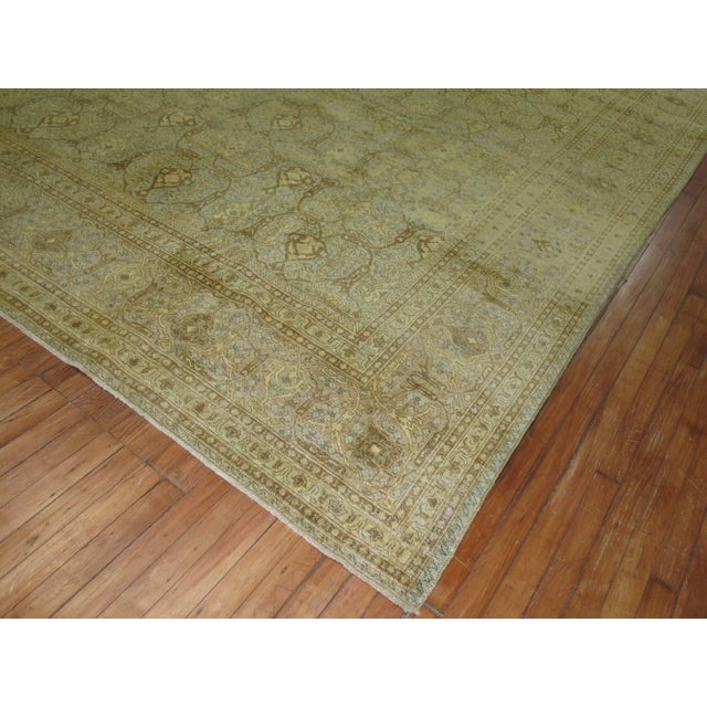 An early 20th century abrashed antique washed oversize Persian Isfahan carpet. 10'5'' x 15'7''