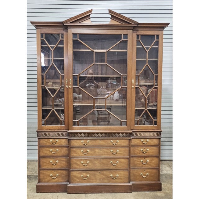 Store Item: Kittinger Colonial Williamsburg Mahogany Breakfront Bookcase (CW-158) Description: This stunning reproduction...