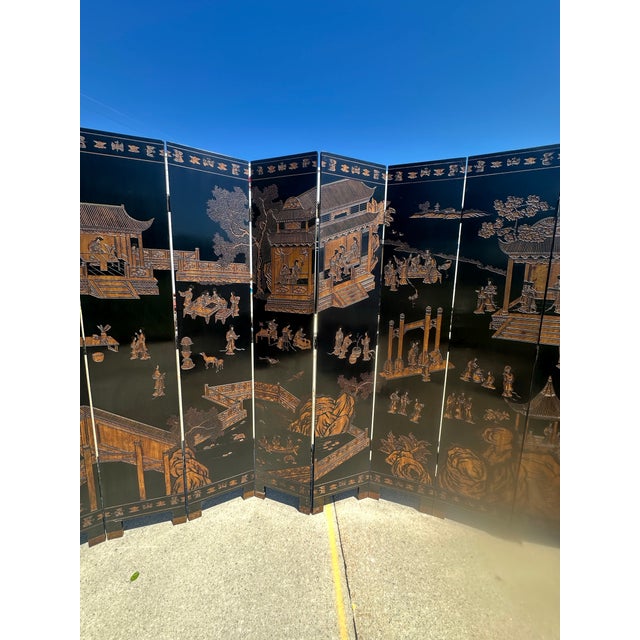 Stunning Maitland Smith chinoiserie 8 panel double-sided coromandel screen. Circa 1990’s. The main face illustrates a...