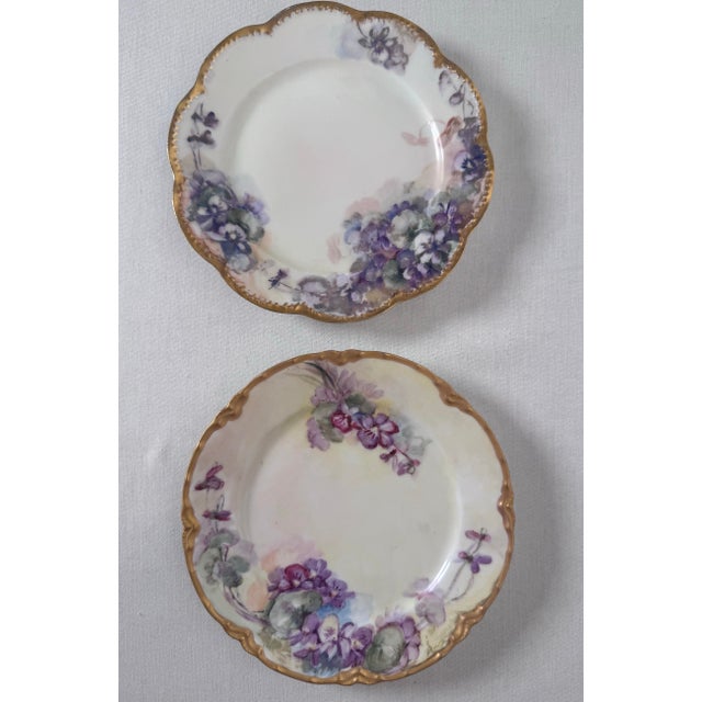 A beautiful, complementary pair of antique French porcelain decorative plates by Haviland & Co. Limoges. Each plate...