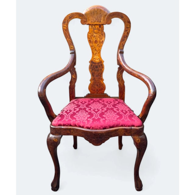 This Early 19th-Century Dutch Marquetry Armchair has elegant , high-end appeal with lavishly embellished inlays that...