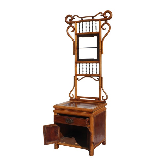 Imbued with the timeless elegance of traditional Chinese craftsmanship, this exquisite tall cabinet seamlessly merges...