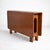 A beautifully designed vintage McIntosh compact drop-leaf dining table, crafted in warm teak and showcasing the clean,...