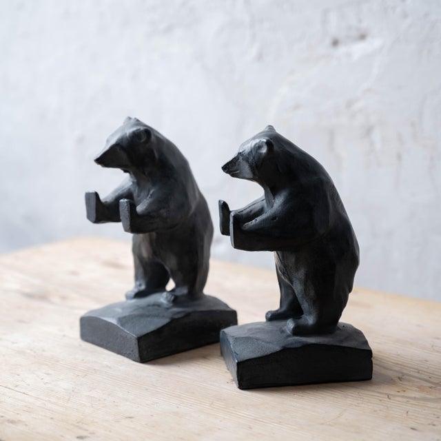 A pair of Takaoka City cast iron bookends modeled as standing bears facing each other with outstretched paws, urushi...
