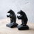 A pair of Takaoka City cast iron bookends modeled as standing bears facing each other with outstretched paws, urushi...