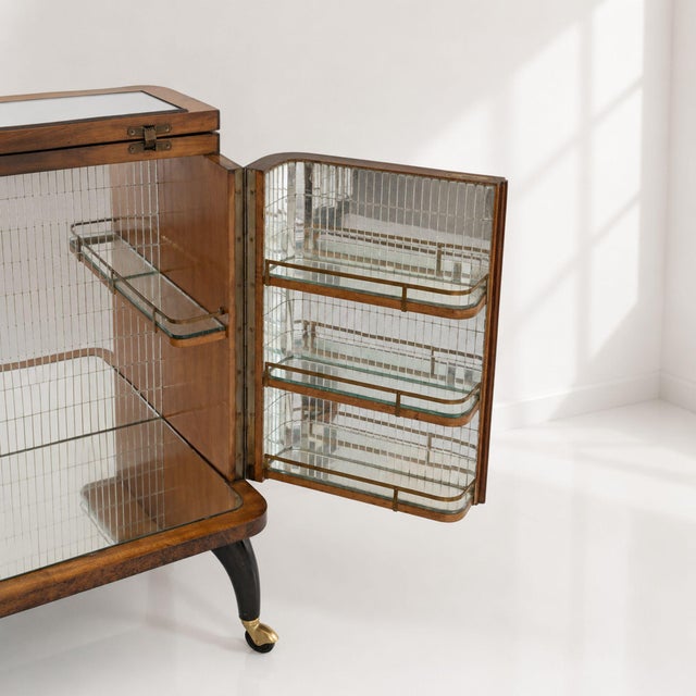 An extraordinary 1950s Italian bar cabinet, crafted from briarwood with an illuminated interior and mosaic mirror cladding...