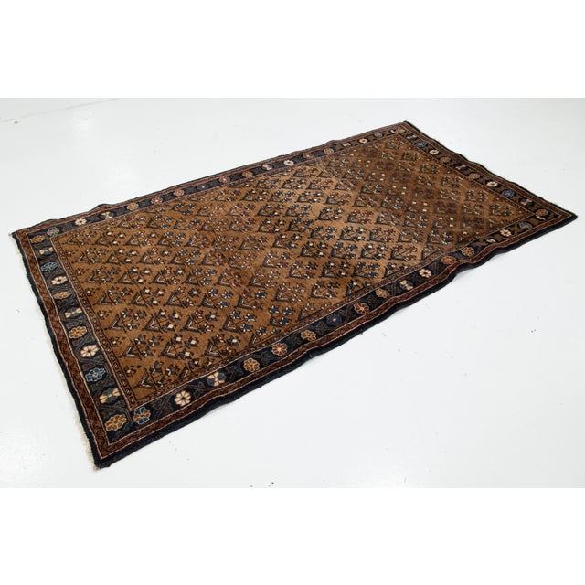 This Vintage Bidjar Handcrafted Wool Rug, a stunning piece that showcases exquisite craftsmanship and timeless elegance....