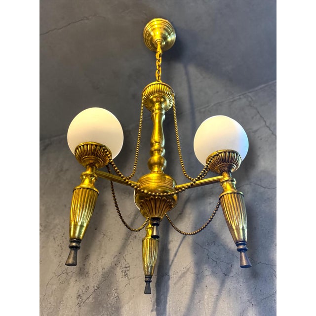 Beautiful antique brass chandelier with 3 light points and original ornate bead garlands. This elegant model has a classic...