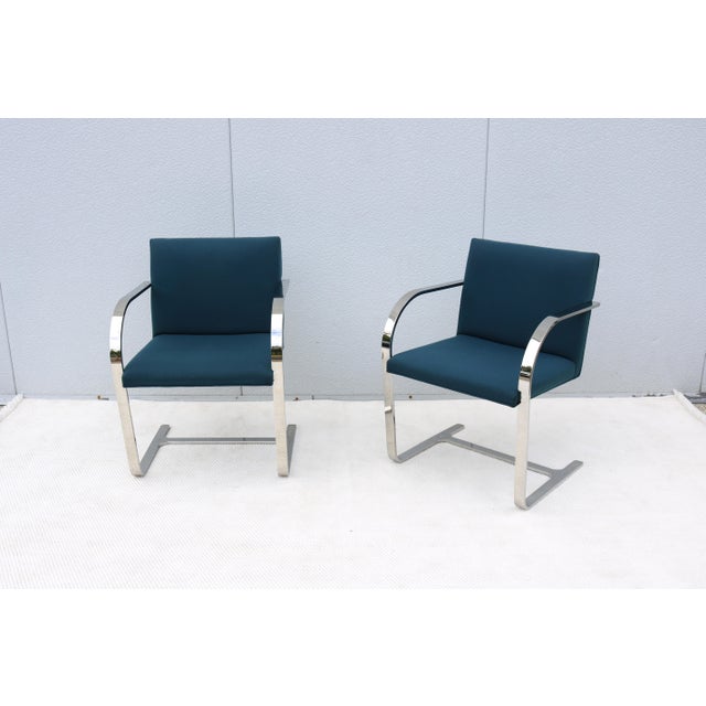 Fabulous pair of Brno flat bar chairs in colonial blue fabric. An icon of Modernist classic design, heavily rooted in...