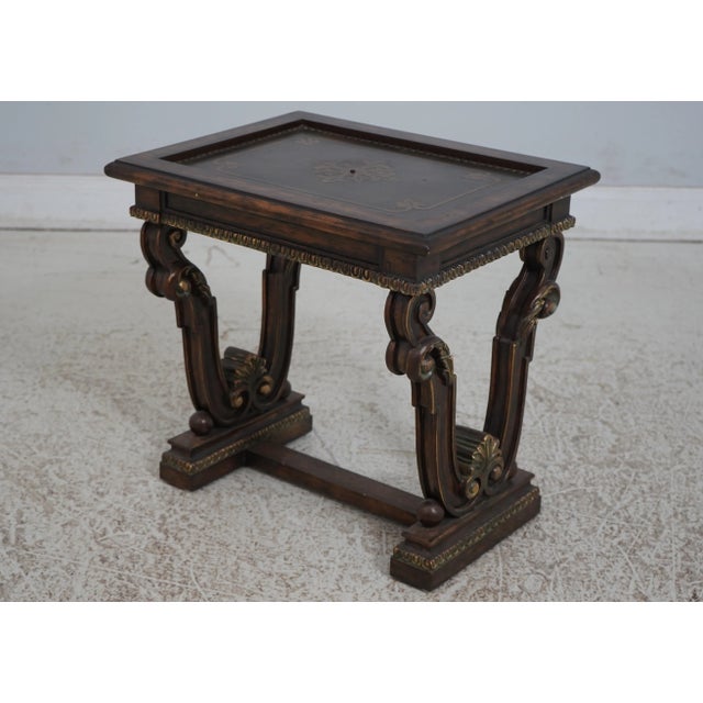 Continental style carved base table. Features copper top and tack head trim on top.