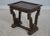 Continental style carved base table. Features copper top and tack head trim on top.
