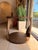 Make a statement with this contemporary sculptural end table, crafted from richly grained wood in a warm walnut-brown...