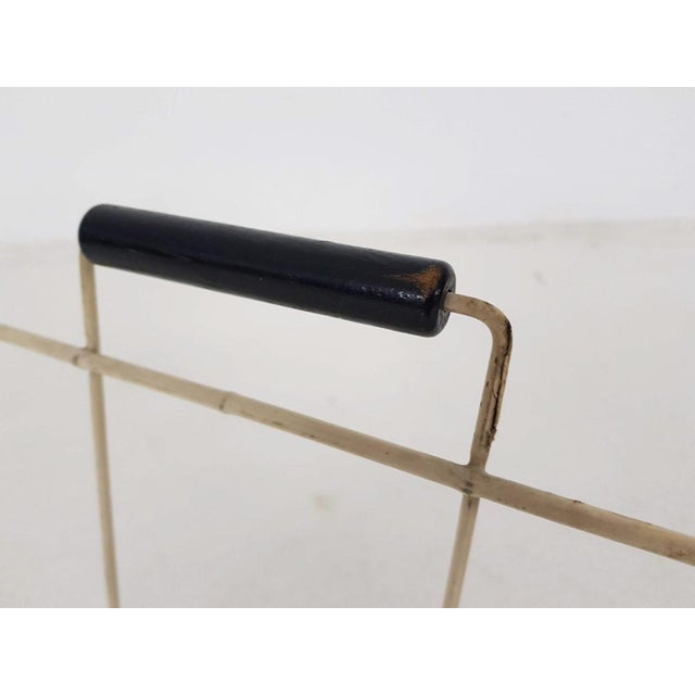 White metal thread magazine stand with wooden handles. Some rust.