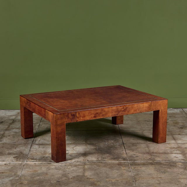 Rectangular leather coffee table by Jeff Knight c.1978, San Francisco. The table features a cognac leather wrapped frame...