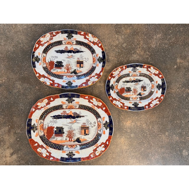 Set of three English Mason’s Patent Ironstone China platters in a bold Imari palette. Each features the iconic oriental...