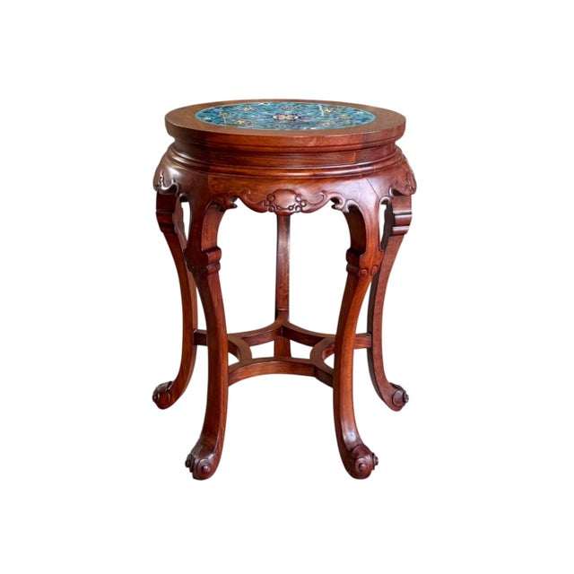 A pair of Chinese side tables in rosewood with striking inset cloisonné panels as the top surface. Shades of green,...