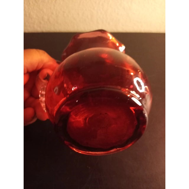 This is a Pilgrim Glass Cranberry 4" Mini Pitcher with Clear applied handle Procured at auction BOX E