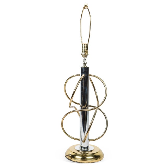 Mid-Century Modern sculptural table lamp with chrome and brass rod details in an intersecting organic form resembling an...