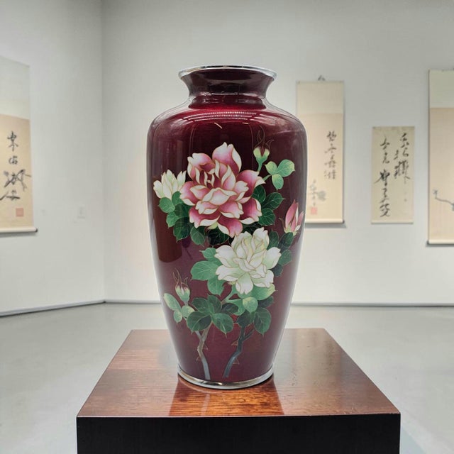 Exceptional signed Japanese Ando Jubei cloisonné vase featuring luminous pigeon blood red enamel decorated with elegant...