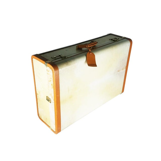 A very rare Prada Pergamena hard travel suitcase. Vintage suitcase covered in parchment with light brown leather edges....