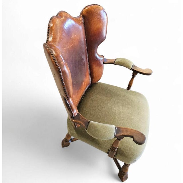 Rare leather and oak wing chair designed by Theo Ruth for Artifort (1915-1971), model f 297 from 1949. Height 104Width...