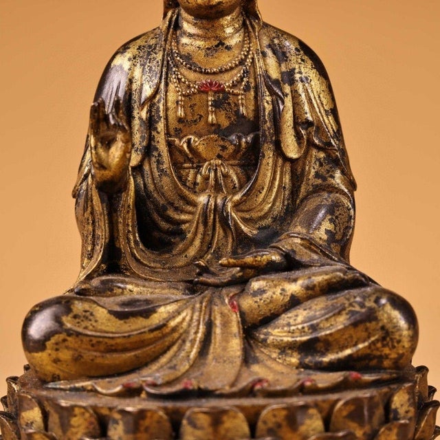 This is a finely cast seated Guanyin (Avalokiteshvara) Bodhisattva statue, crafted from solid bronze with traditional...