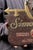 Vintage Simon Pure Beer and Ale advertising sign featuring a deeply textured faux-wood ground with raised lettering and...
