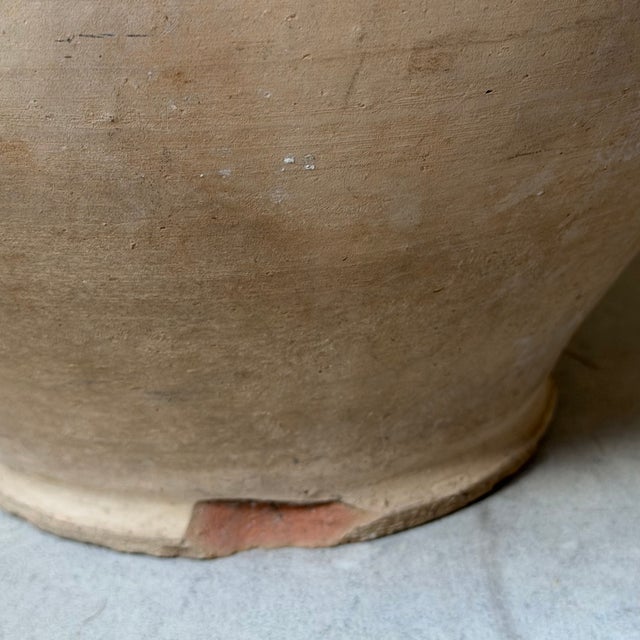 Small terracotta jar from Biot. The interior is fully glazed, and lovely honey-colored drips along the body and rim add to...