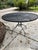 heavy iron salterini iron 48 inch pool side table. recently sandblasted, primed and painted... also sealed, to withstand...