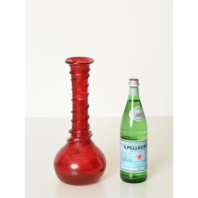 Stunning red blown glass "Scavo" vase attributed to Seguso Vetri d'Arte. This one-of-a-kind piece was designed in Murano,...