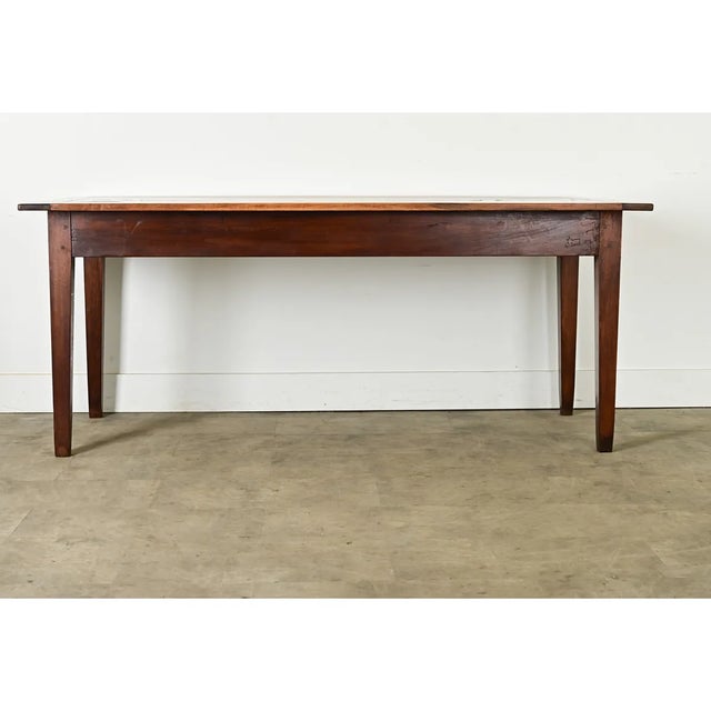 Dimensions: 30 ⅝” H x 74 ½” W x 31 ½” D This rustic farmhouse dining table from France, circa 1860, will easily...