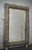 A sturdy smoky-colored frame captures the eye of the observer, leaving him enchanted: it is a wall mirror in smoky-colored...