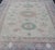 Finely hand knotted Khotan Rug with Circular Medallions in Shades of Purple, light Green, salmon, medium green and Cream....