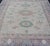 Finely hand knotted Khotan Rug with Circular Medallions in Shades of Purple, light Green, salmon, medium green and Cream....